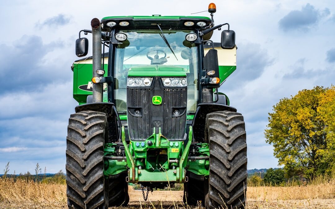 Heavy harvesting equipment operating in a North Georgia field during peak season - diesel delivery farming Georgia