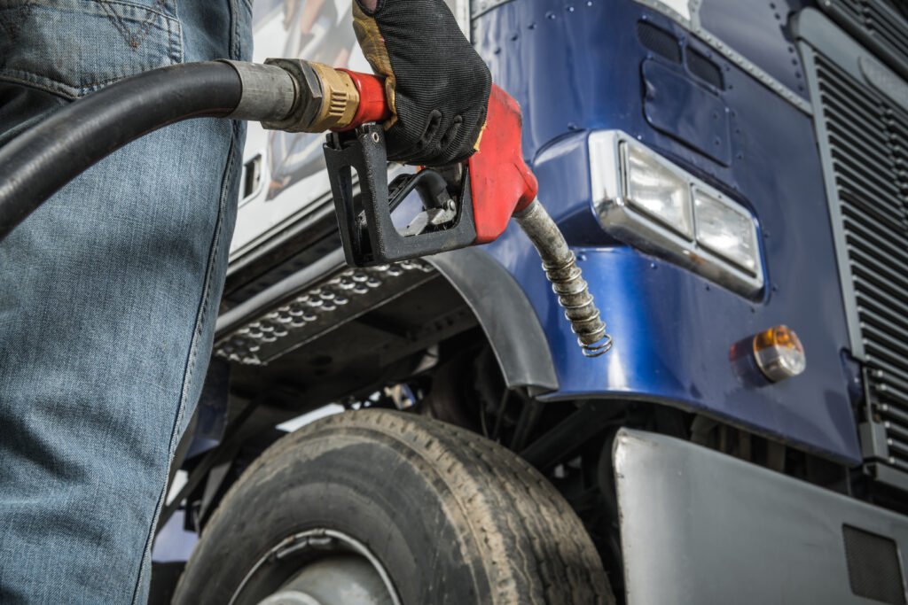 trucker in front of his truck preparing for diesel 2025 03 16 20 10 59 utc